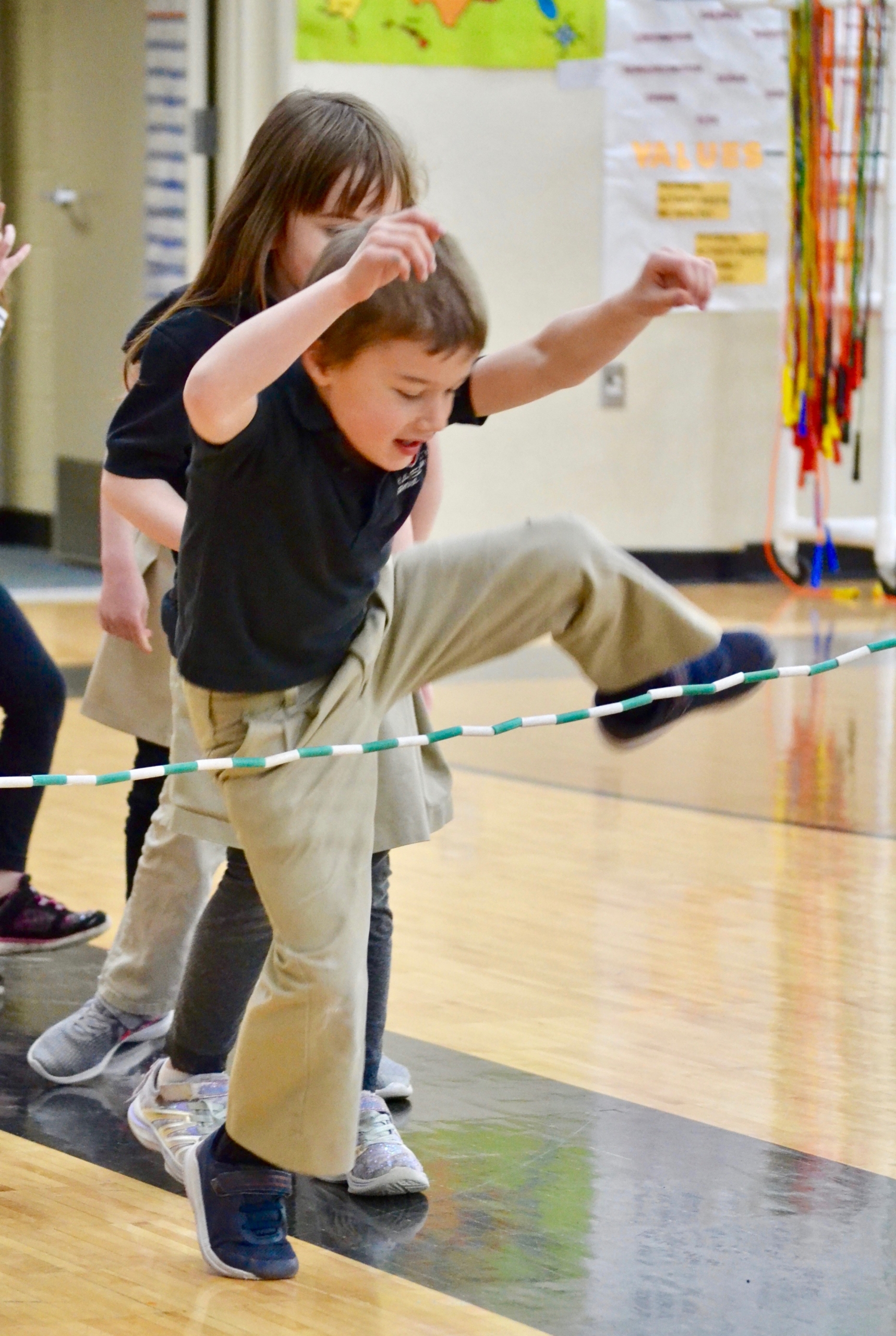 children walking in a straight line